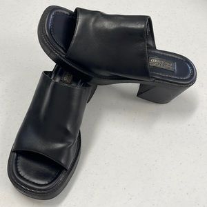 Women’s black clogs
